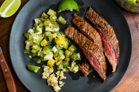 Grilled flank steak with tomatillo pineapple salsa
