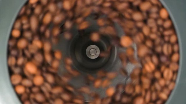 HD - Coffee grinder grinds coffee beans. Slow-mo