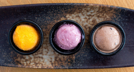 People enjoying food hands getting food serving food eating at a restaurant with friends eating