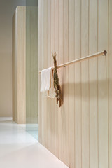 Luminous modern bathroom with light wooden walls