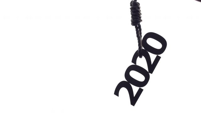 silhouette of rope tightening knot with a loop with numbers on a white isolated background, concept financial collaps, economic crisis in 2020 year