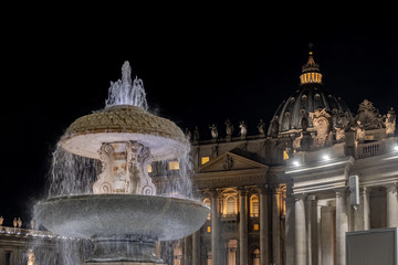 View of St Peter's Basilica in Vatican at night. Roma, Italy 

