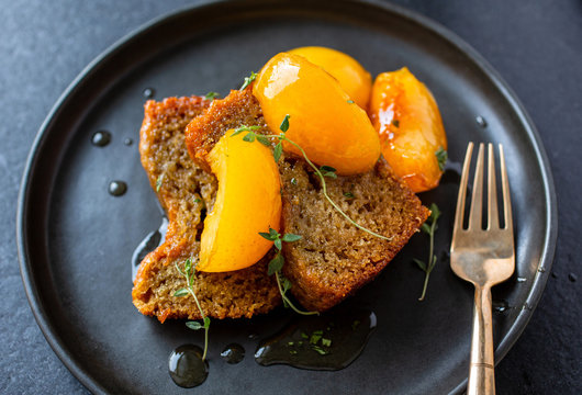 Red wine honey cake with lemon, thyme and plum topping