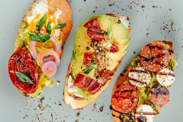 bruschettas with avocado tomatoes mozzarella sun-dried tomatoes and spices