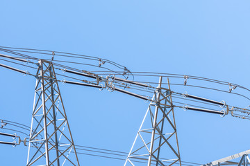 Close up eletrical tower on blue sky