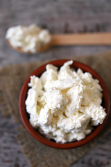 Fresh homemade cottage cheese in a bowl. Grain curd.