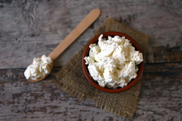 Fresh homemade cottage cheese in a bowl. Grain curd.