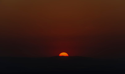 Fototapeta na wymiar Red sun in sunset evening near Ceske Budejovice city