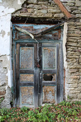 Abandoned house, old closed door.