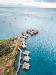 Aerial view on luxury hotel bungalows villas on water Tahiti in French Polynesia by drone 