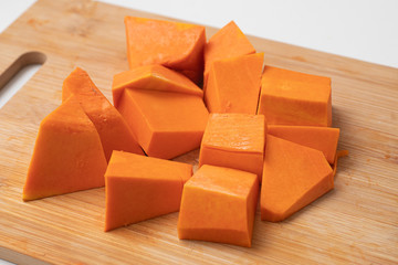 Diced Pumpkin over a wooden board