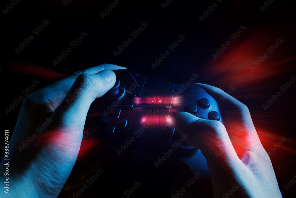 Poster gamer boy with hand holding the joystick controller electronic for playing game with online network 