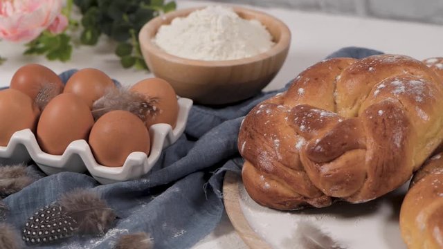 Easter folar and eggs on wooden table top.