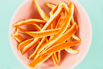 dried fruits, orange peels, rose hip, on a bright background