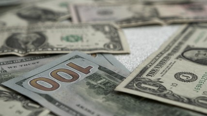 American dollars lie on a bright shiny background.High quality Dollar banknotes