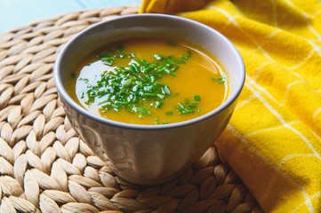 Vegetarian food. Carrot cream soup. Serving in a rustic style. Healthy food.