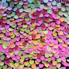 heart-shaped post-its on a wall