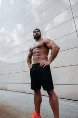 Sexy man posing topless in the hot sun. Fitness. Lifestyle