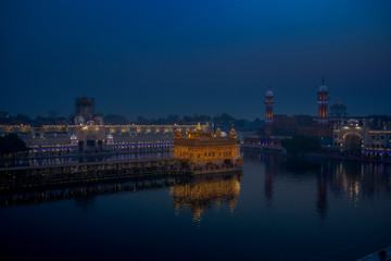 Fototapeta na wymiar Blue hour view or early morning view of golden temple, amritsar using long exposure shooting 