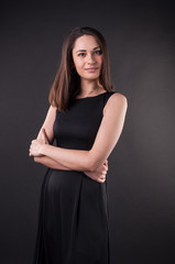 Nice look of beautiful young lady in the darkness. Elegant black dress, so dark everywhere. Amazing girl with attractive appearance