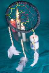 DREAM CATCHER WITH FEATHERS AND MANDALA WITH CANDLES AND GREEN TABLECLOTH 1