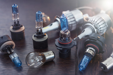 different headlight lamp on dark background. Modern diod halogen and other lamp glass