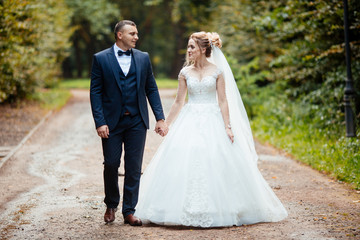 wedding couple in the forest at sunset