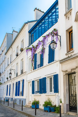 Montmartre in Paris, a charming building with blue shutters
