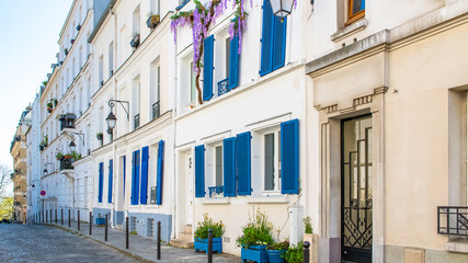 Montmartre in Paris, a charming building with blue shutters
