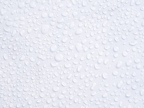 Water drops on white marble  background, texture, top view, copyspace, space for design. Wall after shower in bathroom concept