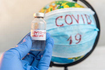 Earth globe with medical mask 2019-nCoV on desk. Coronavirus concept. Corona virus  covid 19  outbreak. outreak and epidemic in the world