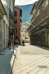 Como, ITALY - August 4, 2019: Local people and tourists on a quiet cozy streets in the center of beautiful Italian Como city. Warm sunny summer day in very popular holiday destination