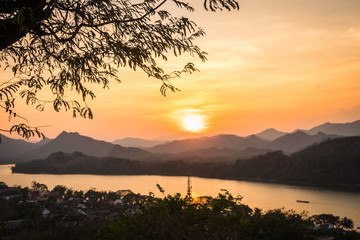 Fototapeta na wymiar Beautiful panoramic view over Luang Prabang from Phousi Hill at sunset in Laos