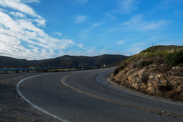road to the mountains with blue skies