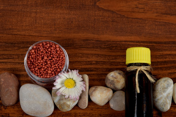 bath oil in a glass bottle with the scent of spring flowers with free space for text