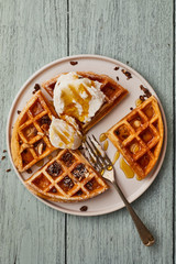 waffle with ice cream and caramel sauce..