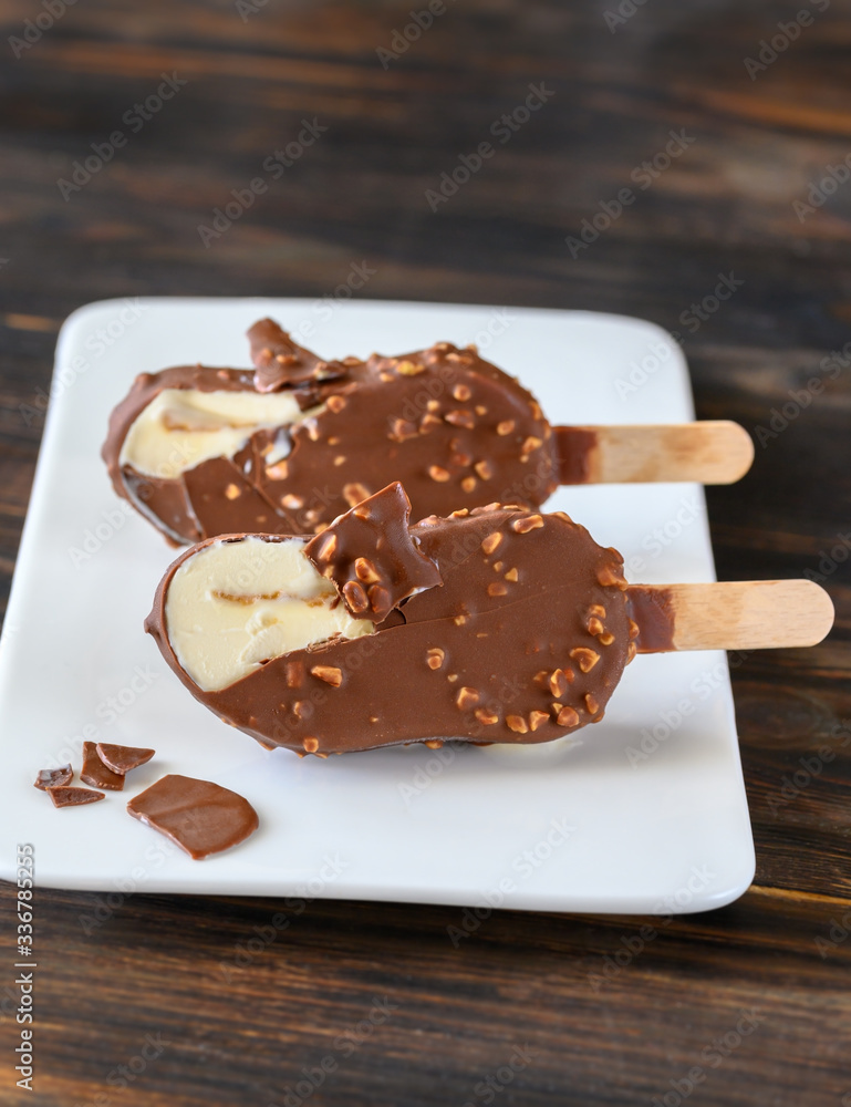 Sticker chocolate-covered vanilla ice cream bar