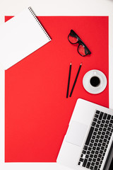 flat view of the office desk with a creative arrangement of stationery and notebooks for the desktop