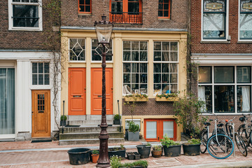 Fototapeta na wymiar Facade of old typical house in Amsterdam historical center, Netherlands.
