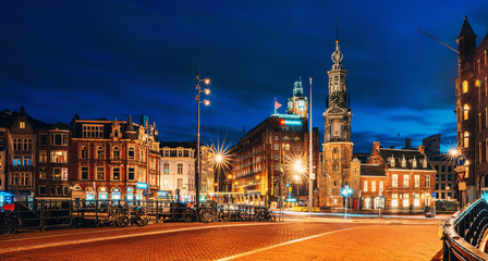Amsterdam city downtown Netherlands at night, Netherlands. Historic houses, streets and evening lights.