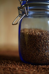 buckwheat in a glass jar on blurred background 