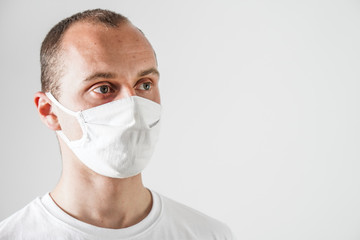Young man wearing protection face mask against coronavirus. 