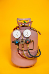 Pressure gauges measuring devices for refueling air conditioners, sensors. Cylinder with freon on a...