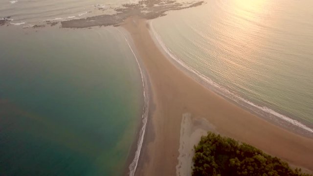 Aerial Drone View of the Beach Whale's Tail during sunset at the Marino Ballena National Park in Uvita, Costa Rica