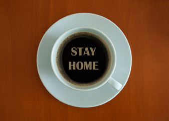 A cup of a long black coffee in a white cup with letters saying 