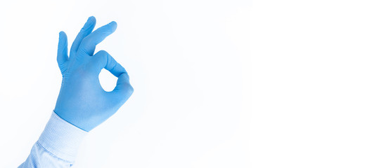 Virus protection products, antibacterial masks, syringes, vaccine, and gloved hands. OK sign with your fingers, complete security. Space for text