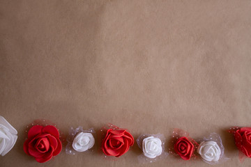 colorful roses on kraft paper background at the bottom