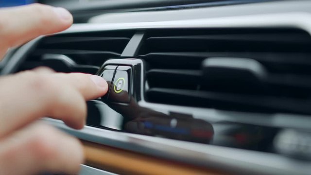 Man hand pushing emergency button at car. Male finger pushing emergency button