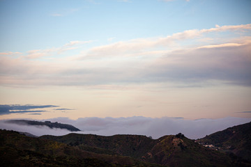 Fototapeta na wymiar sunrise and clouds over the hills