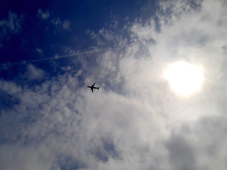 Naklejka na ściany i meble airplane flying in the sky